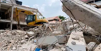 A skilled demolition team is efficiently taking down structures in Miami.